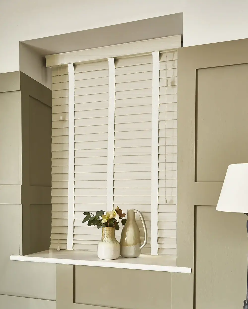 Soft White Faux Wood Blinds for Coastal Interiors light & breezy.